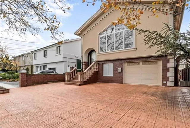 a view of a house with a snow in the yard