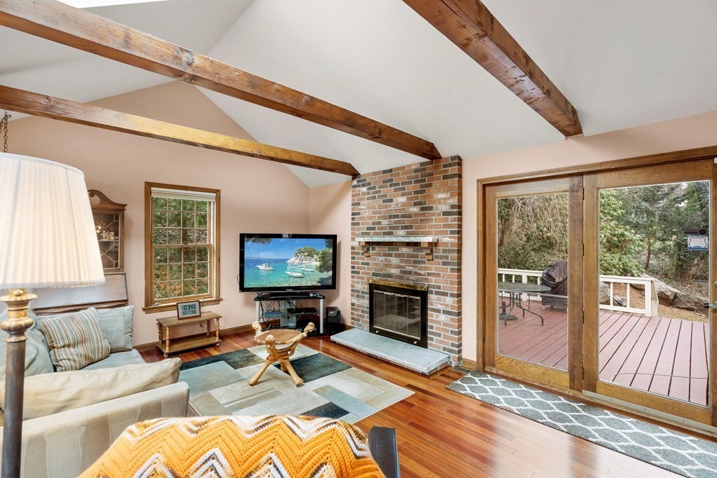 1 Beacon Hill Road Marblehead, MA 01945 - Photo 14 of 30 a living room with furniture flat screen tv and a fireplace