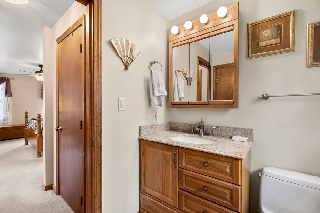 1 Beacon Hill Road Marblehead, MA 01945 - Photo 22 of 30 a bathroom with a sink a vanity and a mirror