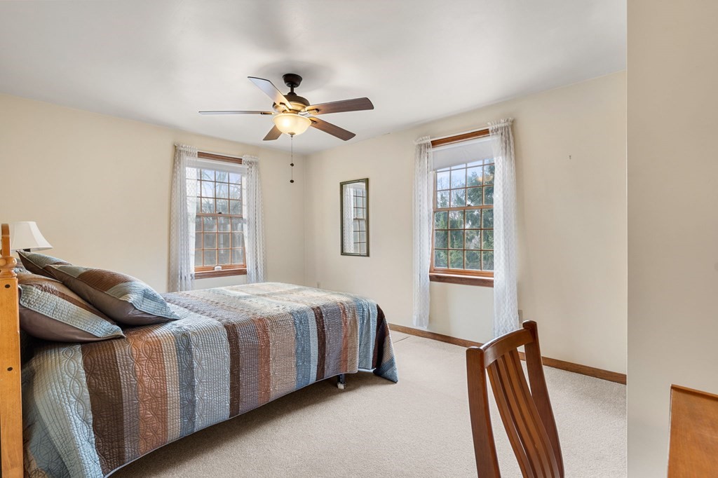 1 Beacon Hill Road Marblehead, MA 01945 - Photo 27 of 30 a bedroom with a bed dresser and a window