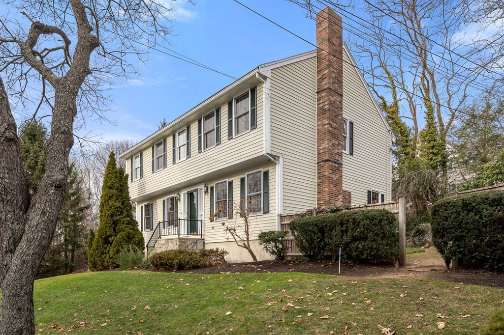 1 Beacon Hill Road Marblehead, MA 01945 - Photo 4 of 30 a front view of a house with a yard and potted plants