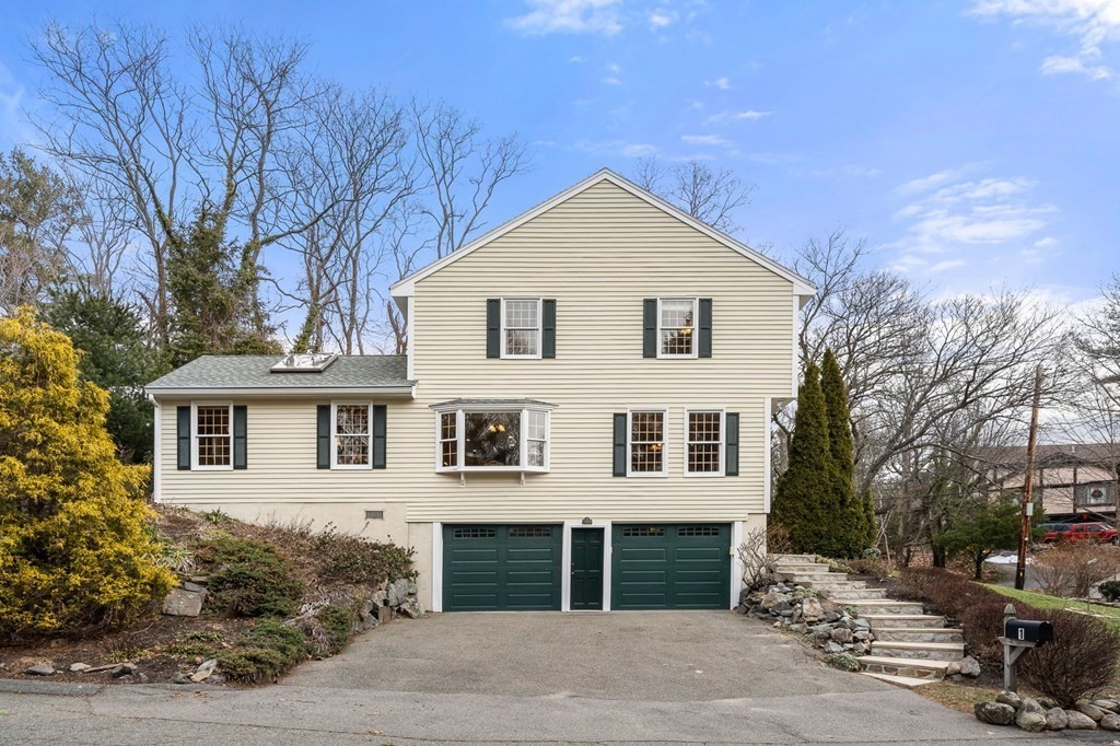 1 Beacon Hill Road Marblehead, MA 01945 - Photo 5 of 30 a front view of a house with a yard and garage