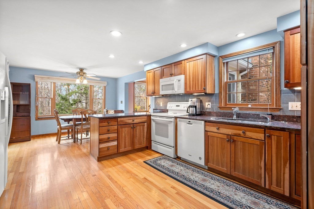 1 Beacon Hill Road Marblehead, MA 01945 - Photo 7 of 30 a kitchen with sink cabinets and wooden floor