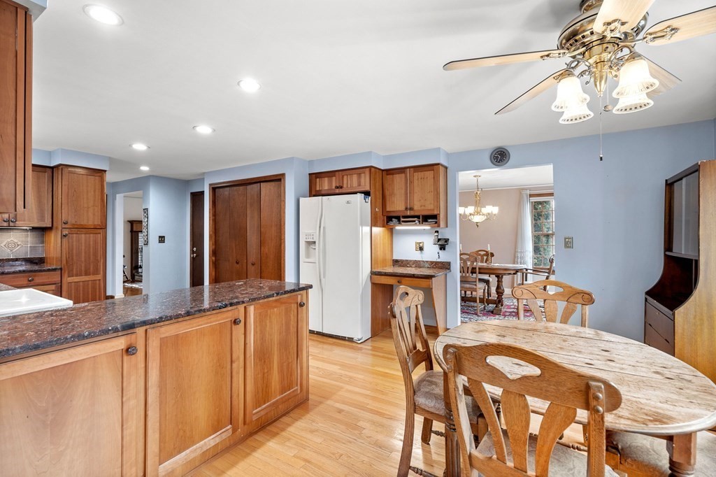 1 Beacon Hill Road Marblehead, MA 01945 - Photo 9 of 30 a kitchen with stainless steel appliances granite countertop a refrigerator and a stove top oven