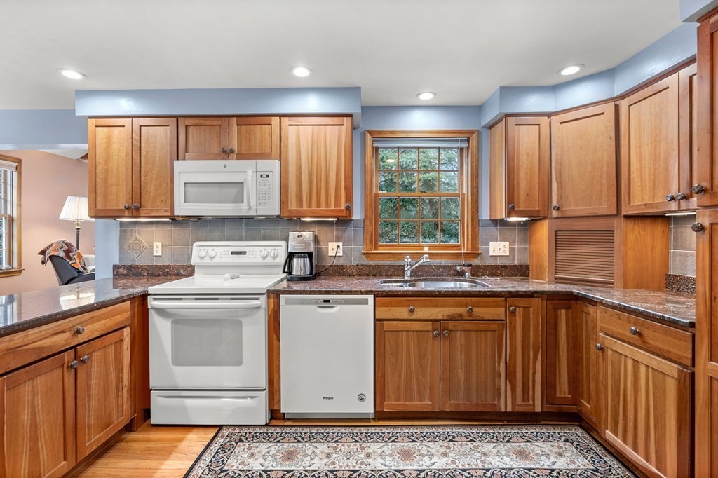 1 Beacon Hill Road Marblehead, MA 01945 - Photo 10 of 30 a kitchen with a sink stove and cabinets