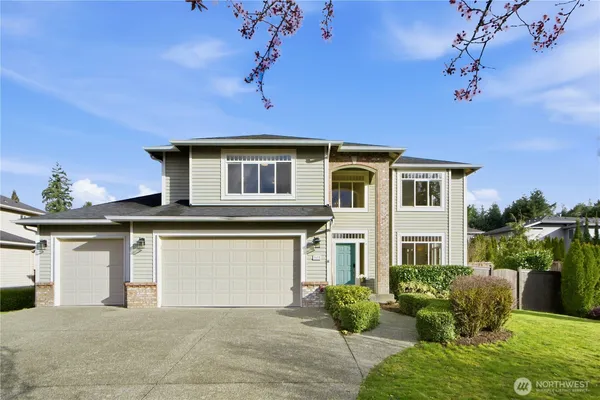 a front view of a house with a yard