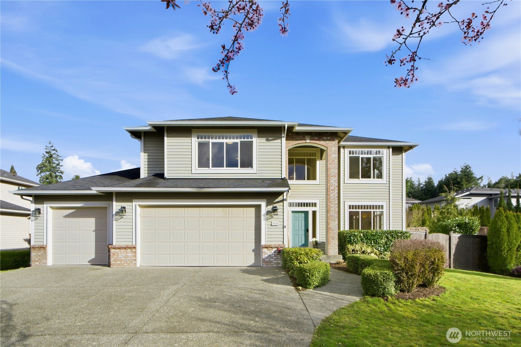 1611 242nd Street Southeast Bothell, WA 98021 - Photo 1 of 39 a front view of a house with a yard