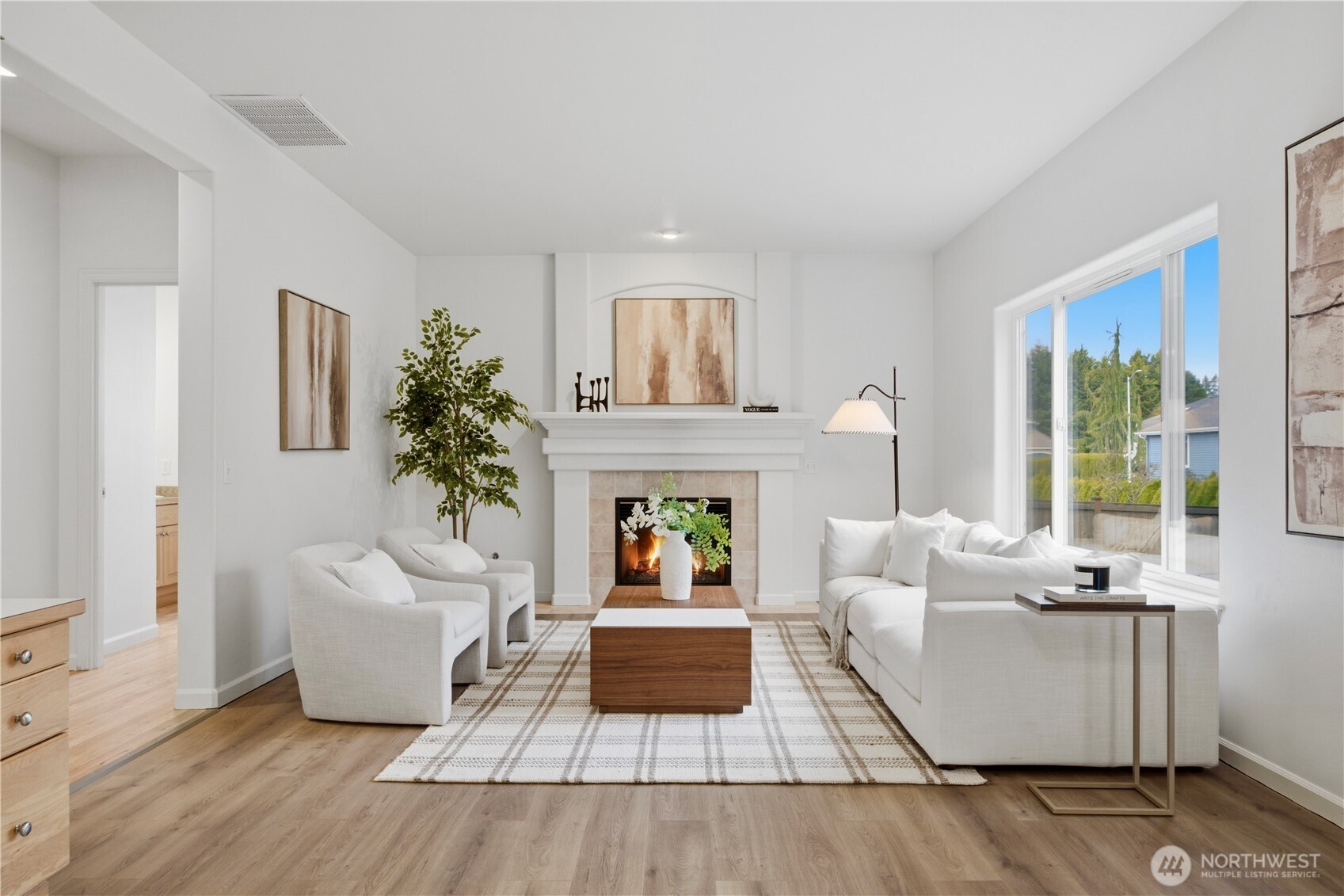 1611 242nd Street Southeast Bothell, WA 98021 - Photo 12 of 39 a living room with furniture and a fireplace