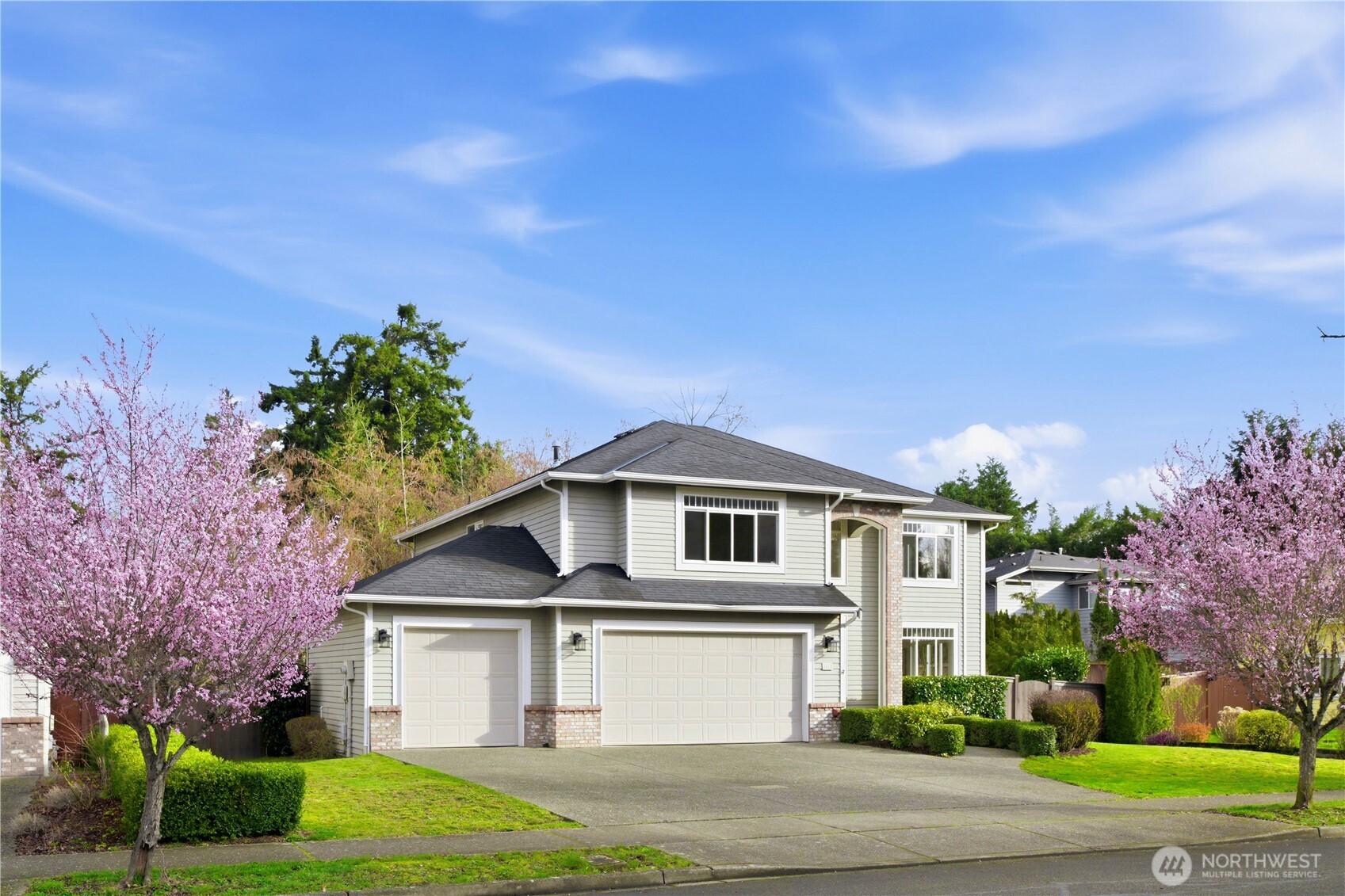 1611 242nd Street Southeast Bothell, WA 98021 - Photo 2 of 39 a front view of a house with garden