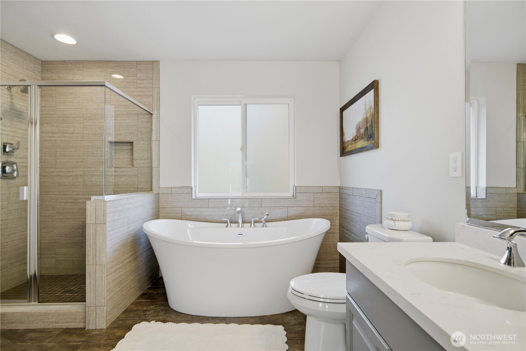 1611 242nd Street Southeast Bothell, WA 98021 - Photo 22 of 39 a bathroom with a sink toilet and shower