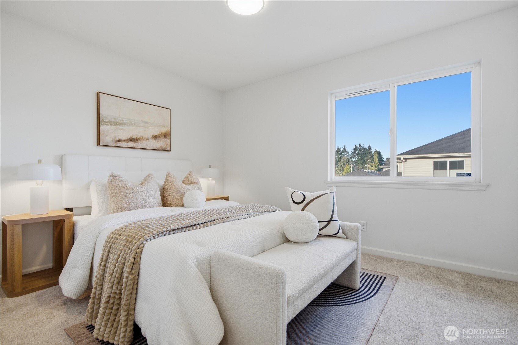 1611 242nd Street Southeast Bothell, WA 98021 - Photo 23 of 39 a bedroom with a bed and a painting on the wall