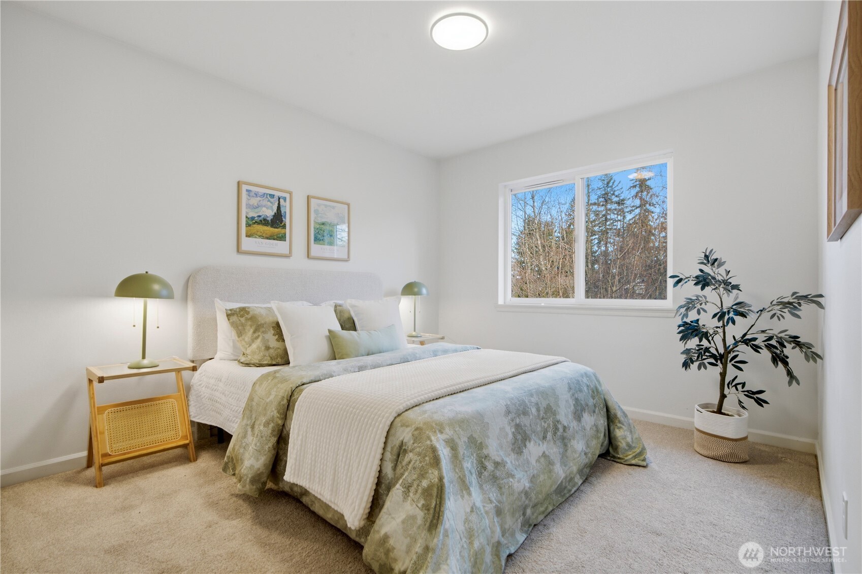 1611 242nd Street Southeast Bothell, WA 98021 - Photo 24 of 39 a bedroom with a bed and a potted plant