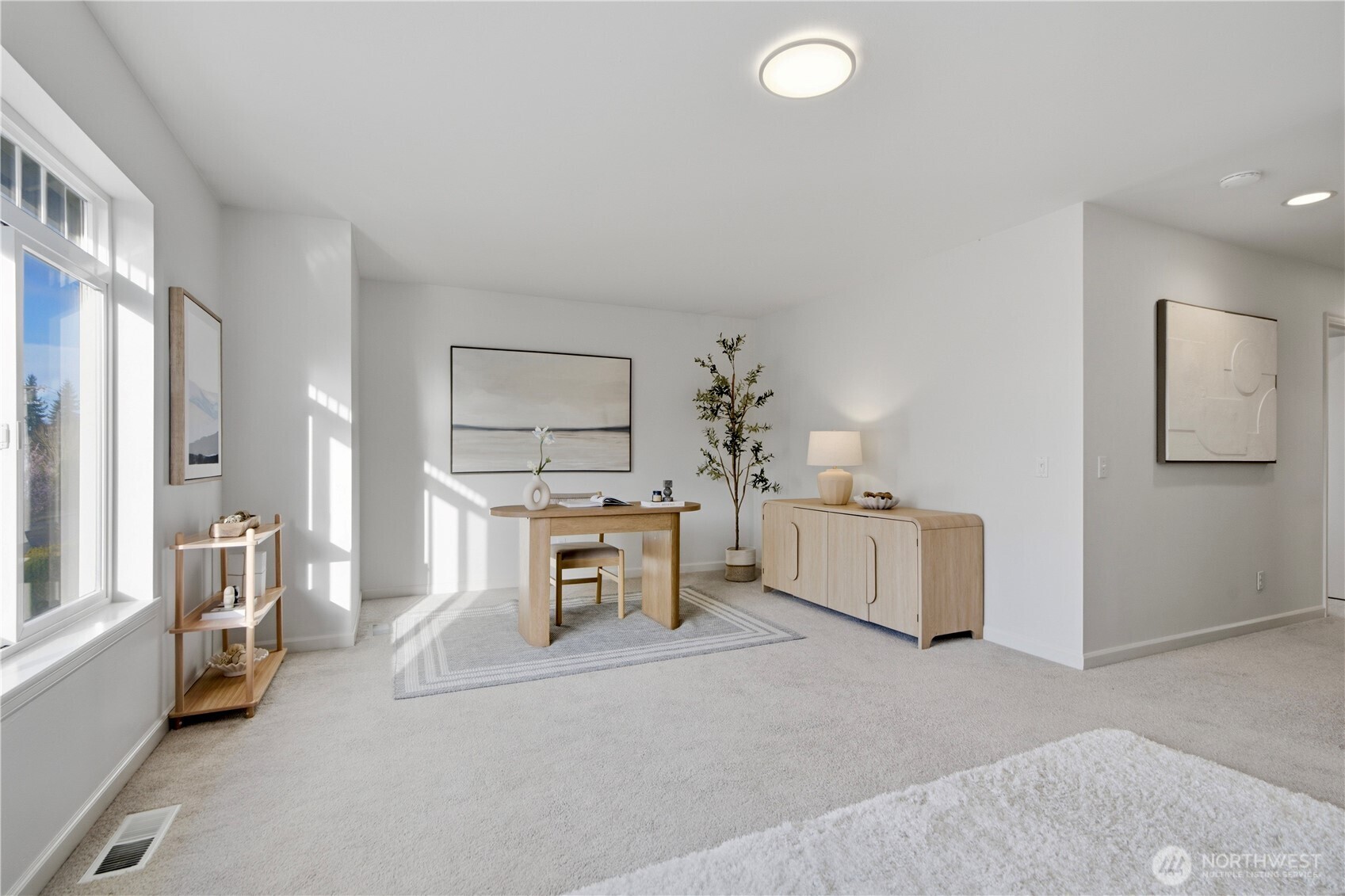 1611 242nd Street Southeast Bothell, WA 98021 - Photo 27 of 39 a living room with furniture and a table