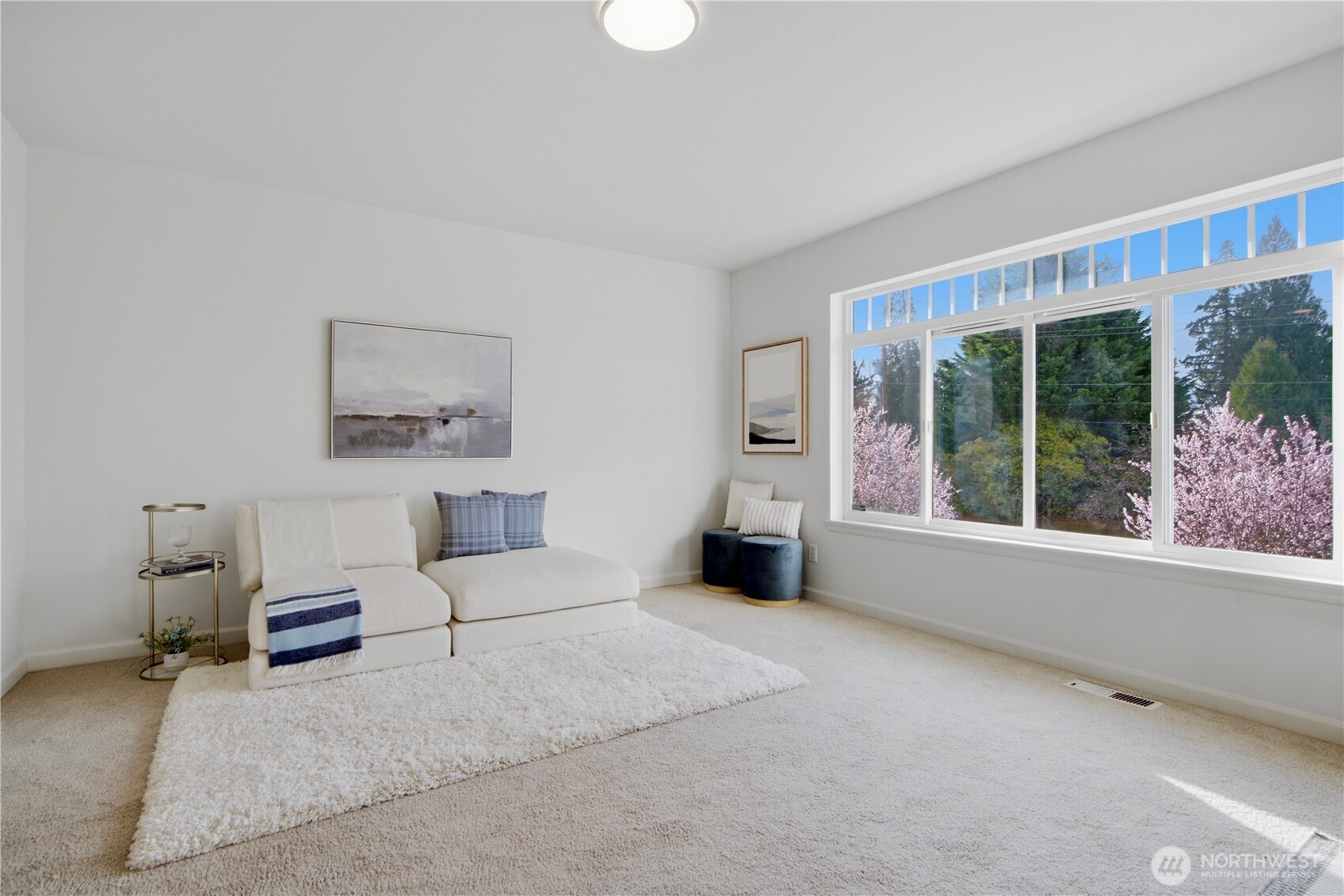 1611 242nd Street Southeast Bothell, WA 98021 - Photo 28 of 39 a living room with furniture and a large window