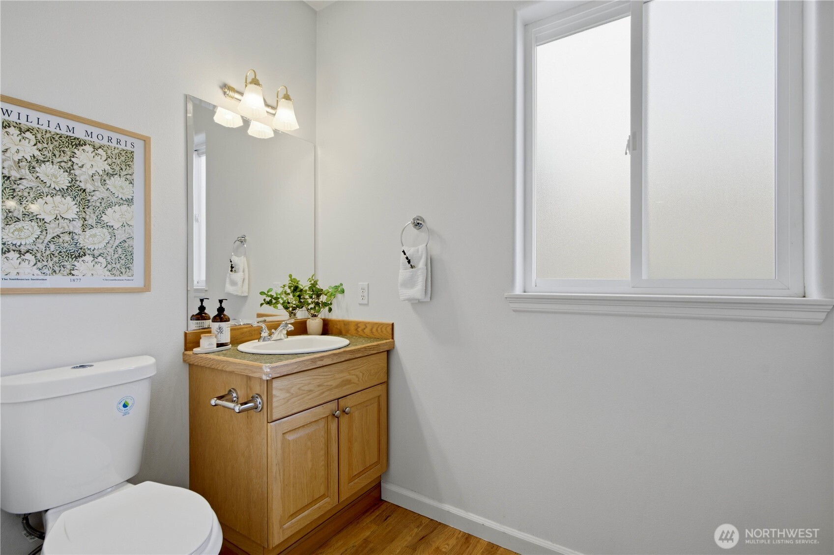 1611 242nd Street Southeast Bothell, WA 98021 - Photo 30 of 39 a bathroom with a toilet a sink and a mirror
