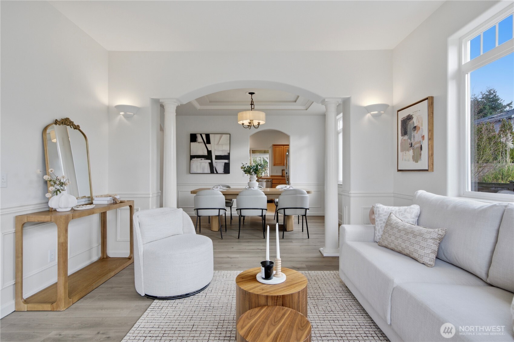 1611 242nd Street Southeast Bothell, WA 98021 - Photo 7 of 39 a living room with furniture a rug and a chandelier