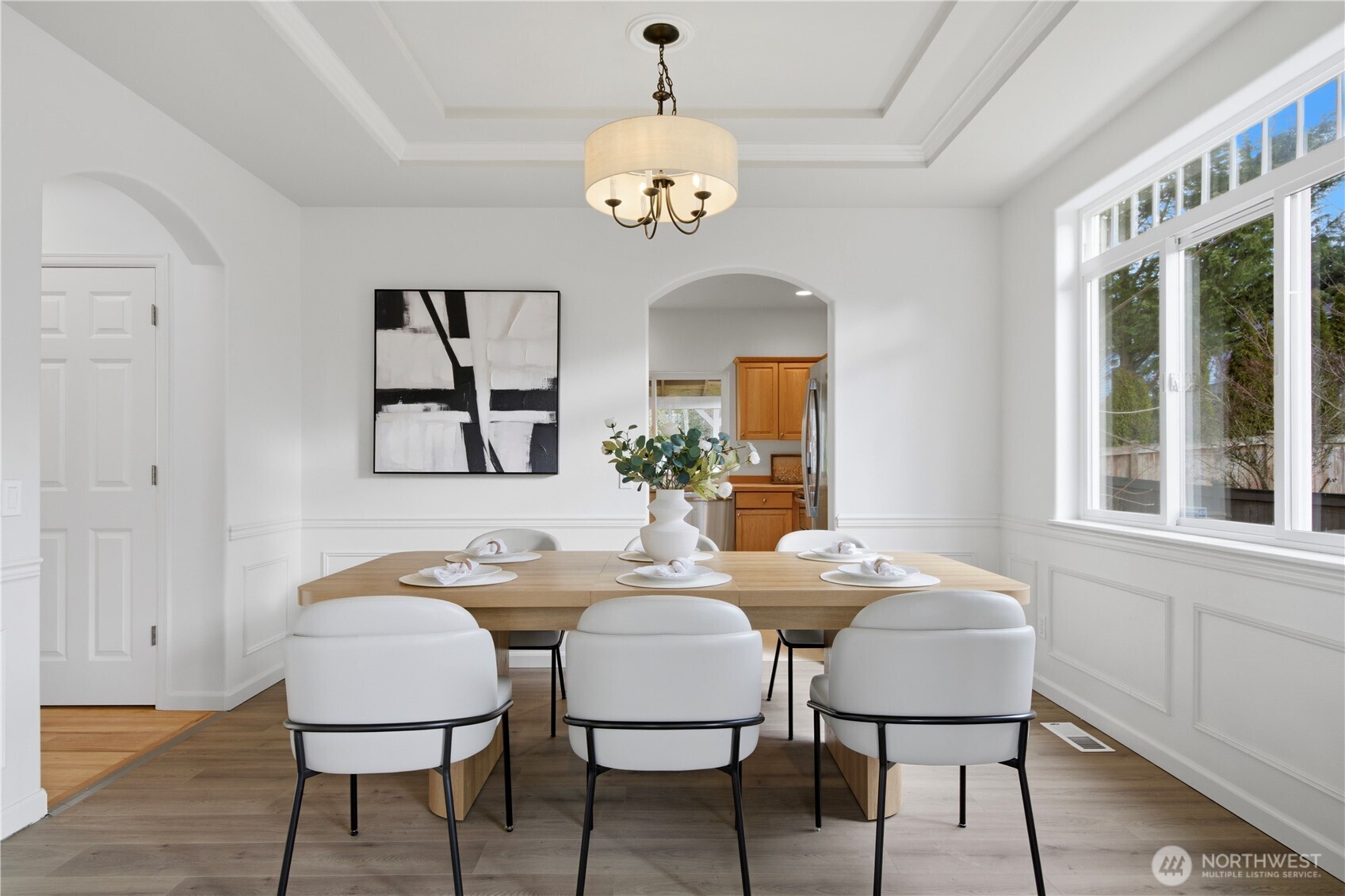 1611 242nd Street Southeast Bothell, WA 98021 - Photo 8 of 39 a dining room with furniture a chandelier and a window