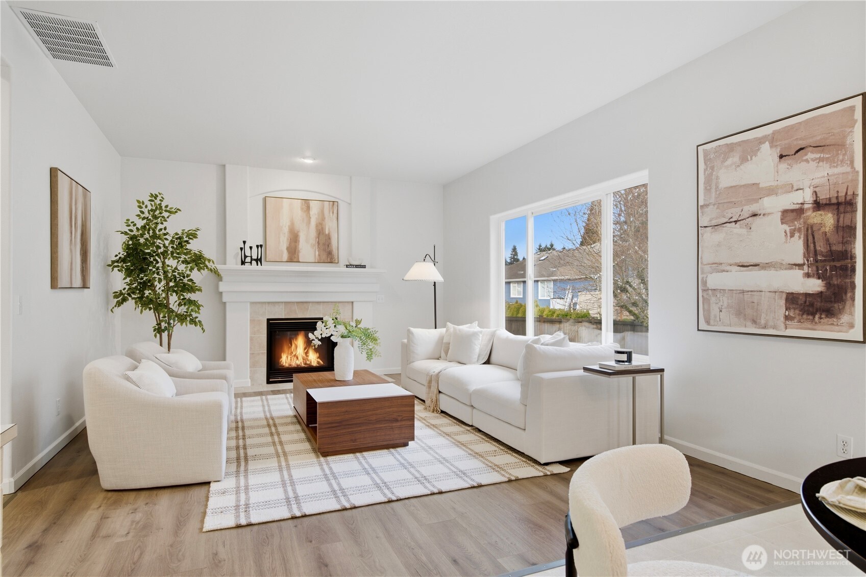1611 242nd Street Southeast Bothell, WA 98021 - Photo 10 of 39 a living room with furniture and a fireplace