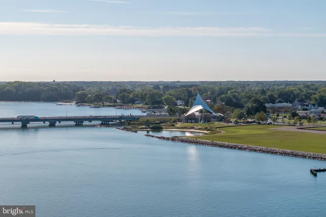 a living room with furniture and painting on the wall