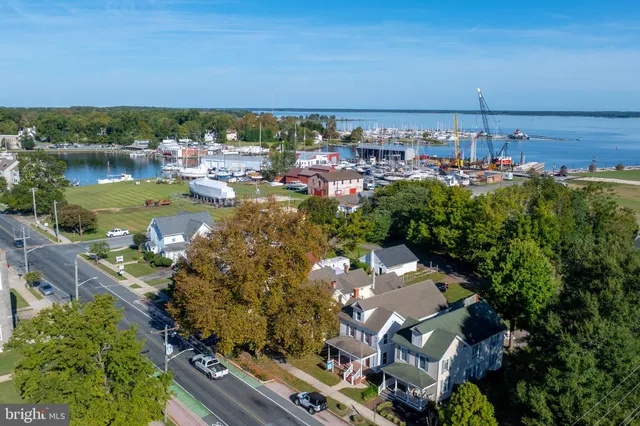 an aerial view of a city with ocean view