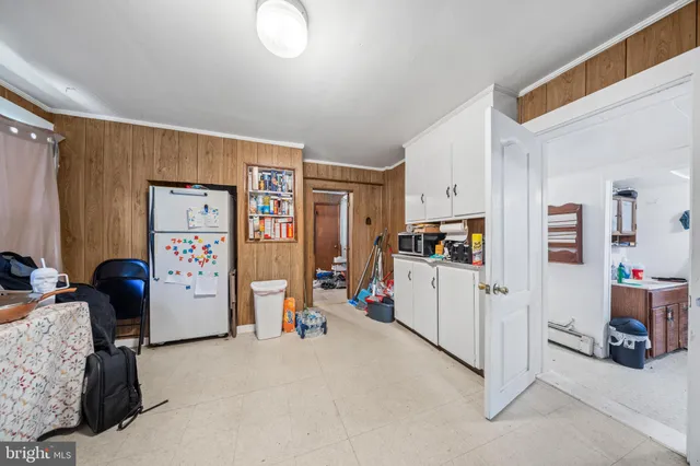 a view of a workspace with furniture and a bedroom