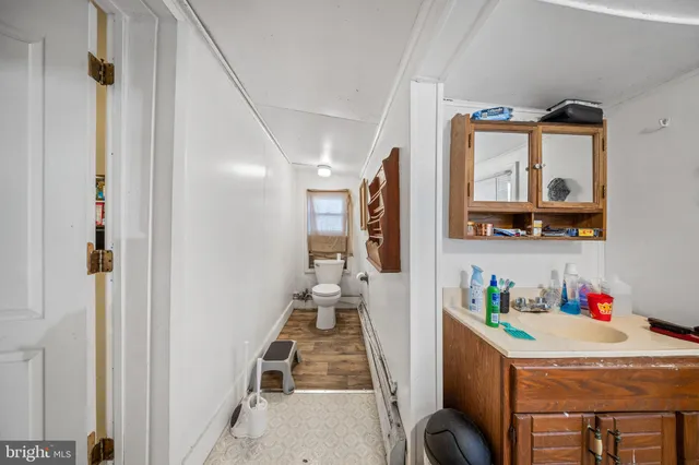 a bed room with a bed and a television