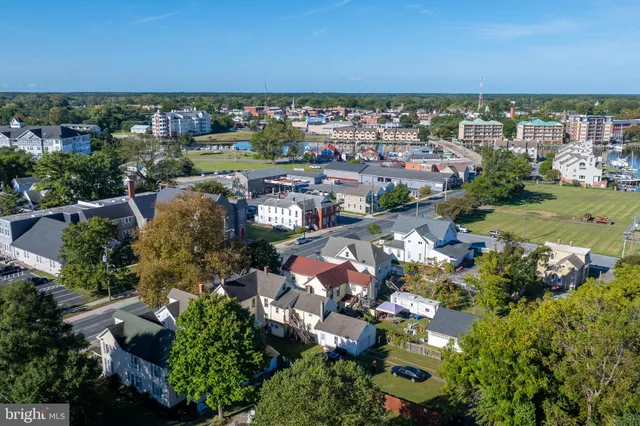 an aerial view of a house with outdoor space