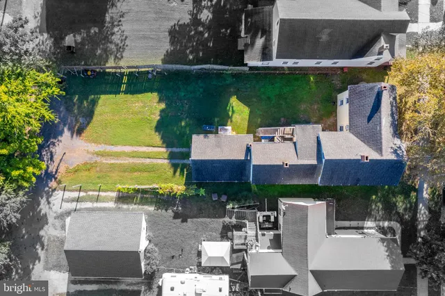 an aerial view of a house with a lake view