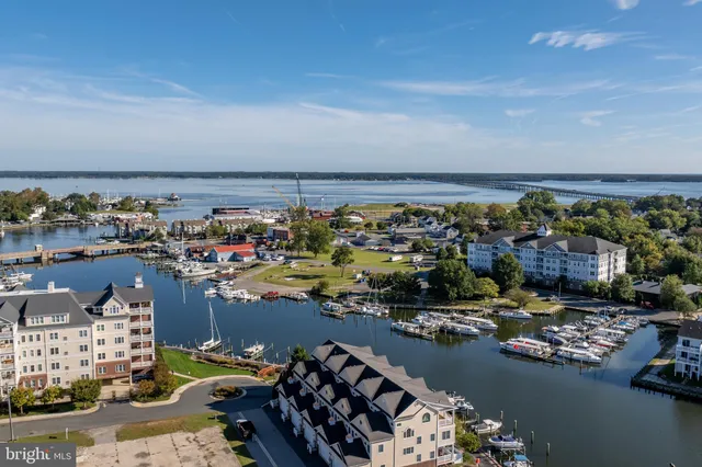 an aerial view of a swimming pool with seating space
