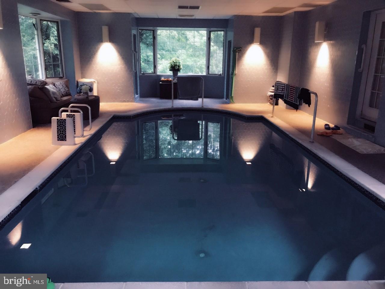 5004 Kennett Pike Wilmington, DE 19807 - Photo 22 of 37 a view of a livingroom with furniture and a fireplace