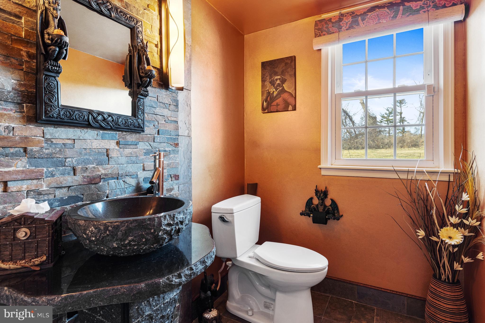5004 Kennett Pike Wilmington, DE 19807 - Photo 23 of 37 a bathroom with a toilet sink and mirror