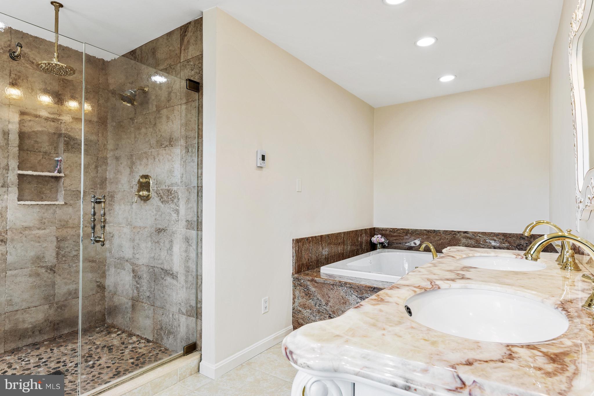 5004 Kennett Pike Wilmington, DE 19807 - Photo 27 of 37 a bathroom with a sink and shower