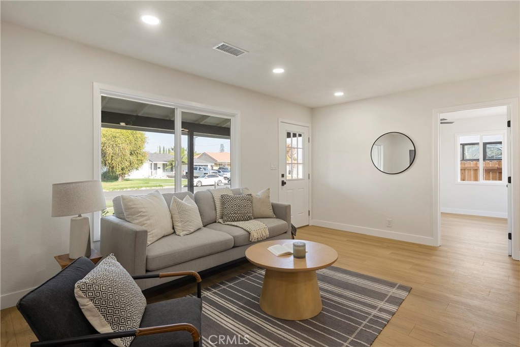 9130 Hargill Street Bellflower, CA 90706 - Photo 3 of 11 a living room with furniture and a window