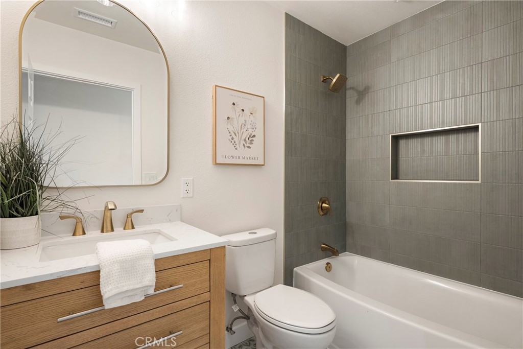 9130 Hargill Street Bellflower, CA 90706 - Photo 10 of 11 a bathroom with a sink a toilet and shower