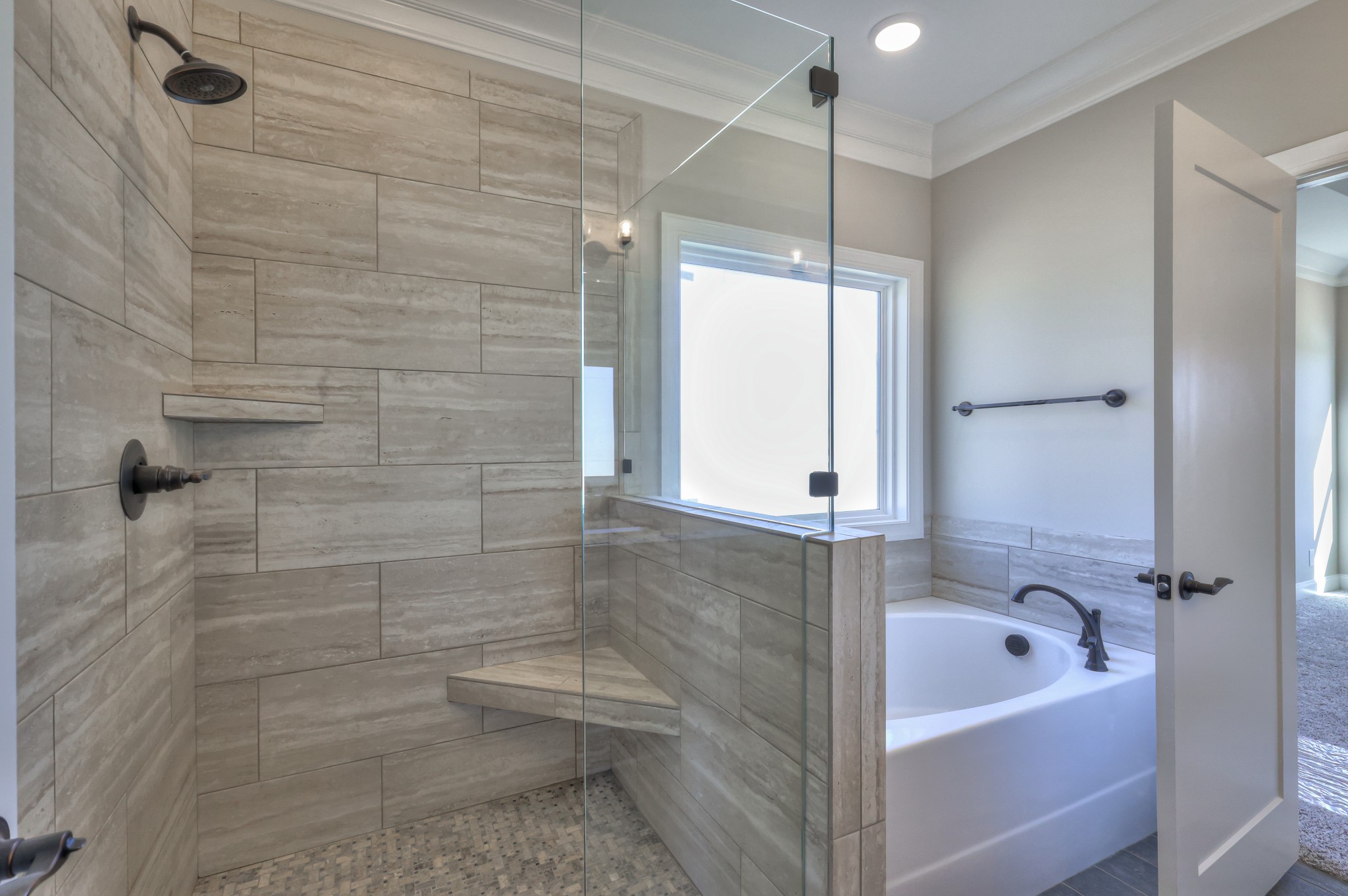 1875 Templow Road Bethpage, TN 37022 - Photo 12 of 49 a bathroom with a tub a window and a shower