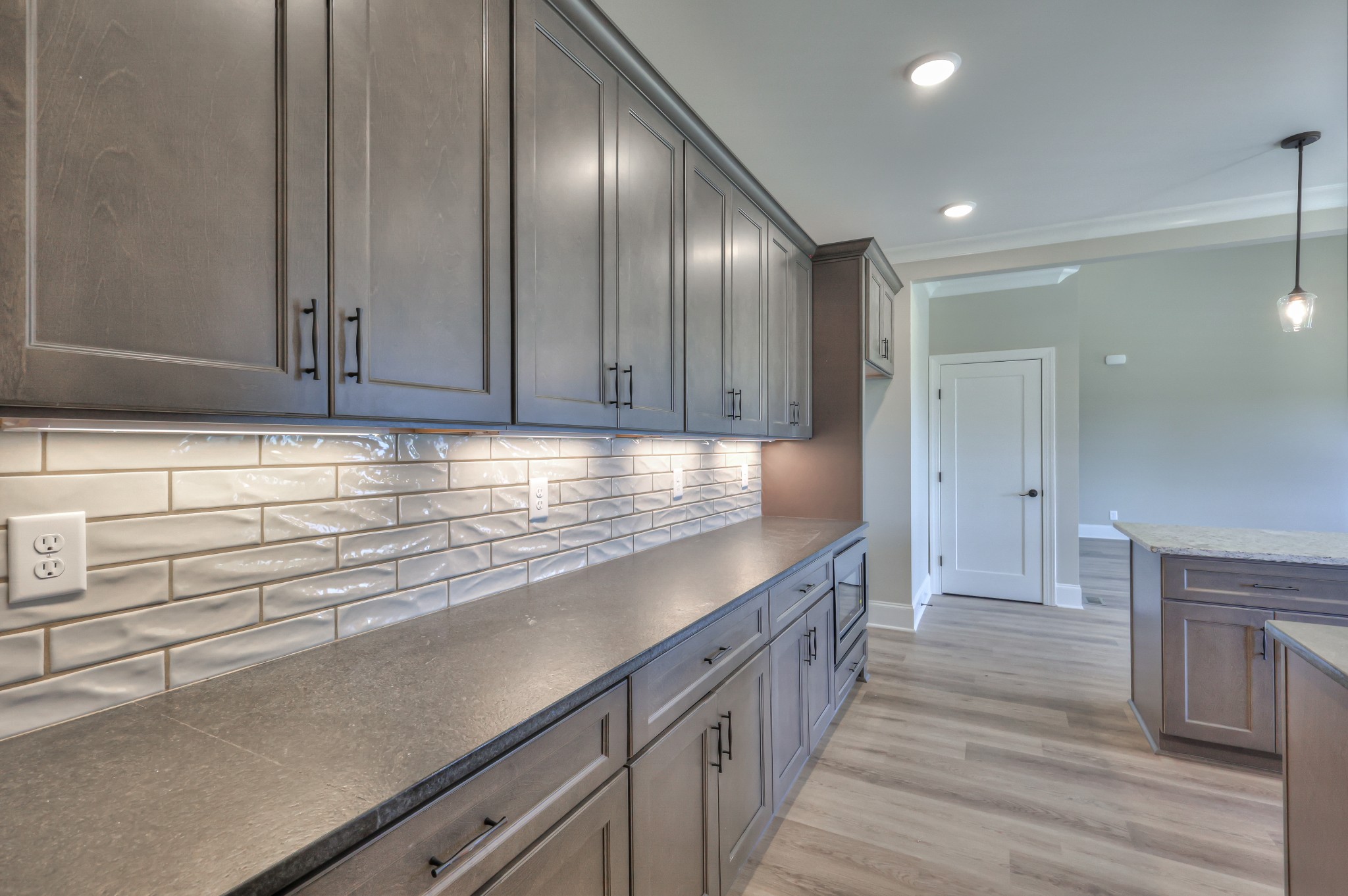 1875 Templow Road Bethpage, TN 37022 - Photo 37 of 49 a kitchen with granite countertop cabinets and wooden floor