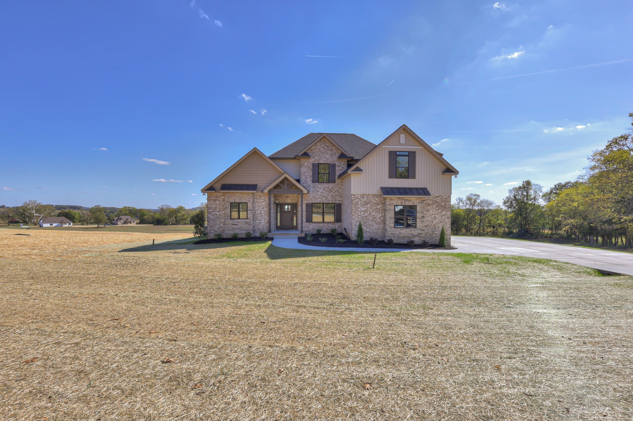 1875 Templow Road Bethpage, TN 37022 - Photo 47 of 49 a front view of a house with a yard and a large tree