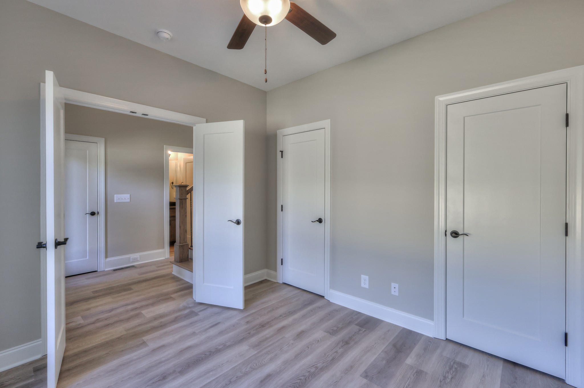 1875 Templow Road Bethpage, TN 37022 - Photo 6 of 49 an empty room with wooden floor and mirror