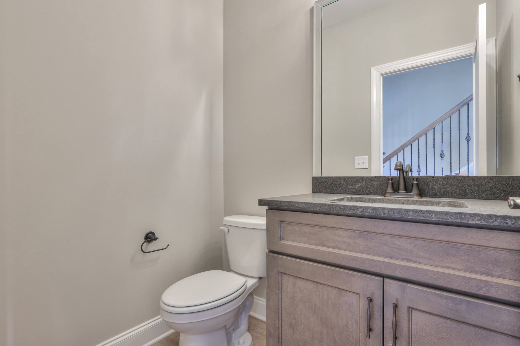 1875 Templow Road Bethpage, TN 37022 - Photo 7 of 49 a bathroom with a granite countertop toilet and a sink