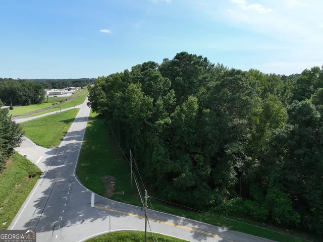 a view of a pathway both side of grassy field