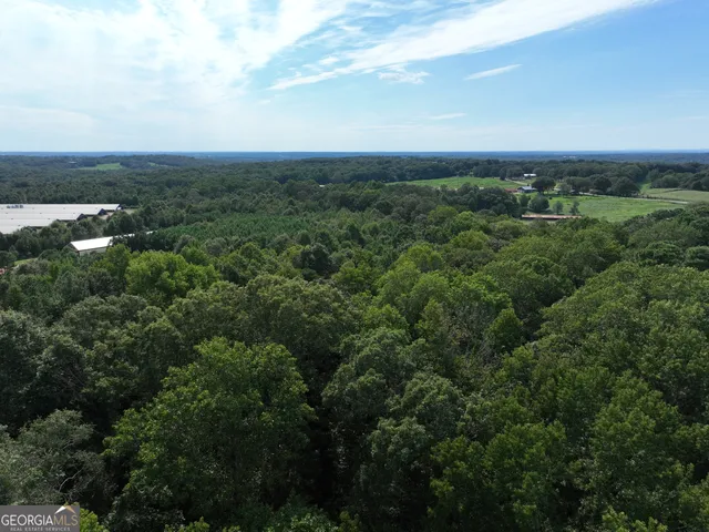 a view of a yard with an outdoor seating