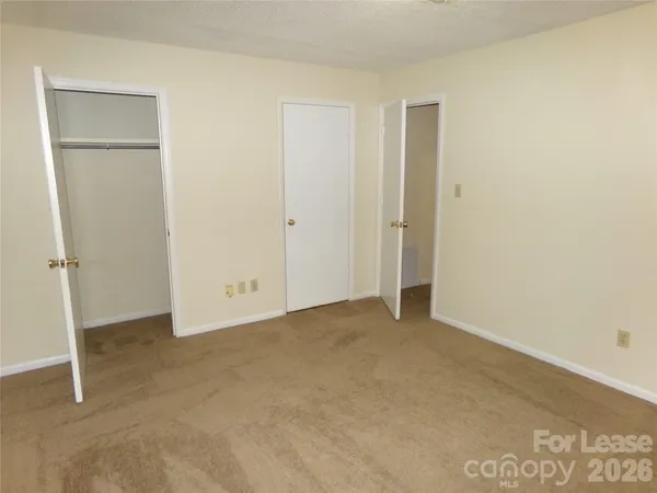 a bathroom with a toilet and a bath tub