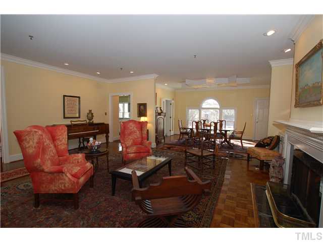 1612 Oberlin Road, Unit 5 Raleigh, NC 27608 - Photo 5 of 25 a living room with furniture and a fireplace