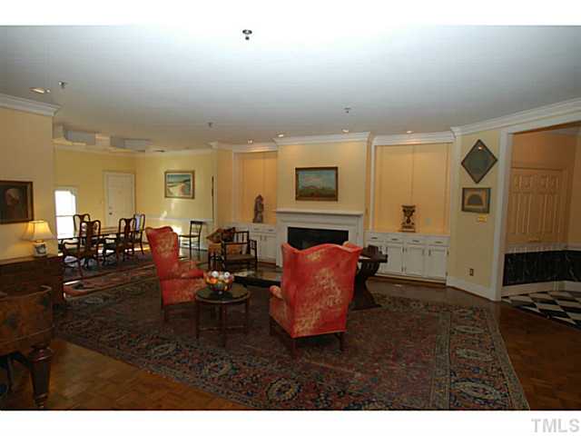 1612 Oberlin Road, Unit 5 Raleigh, NC 27608 - Photo 7 of 25 a living room with furniture a flat screen tv and a fireplace