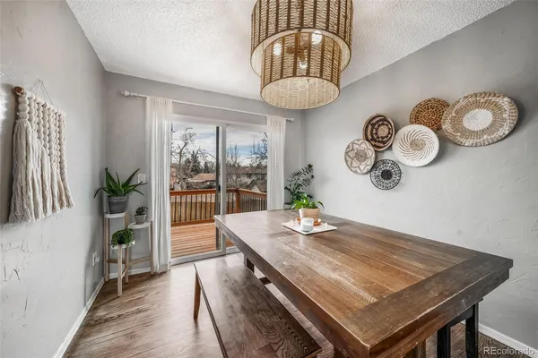 a view of a dining room with furniture window and chandelier