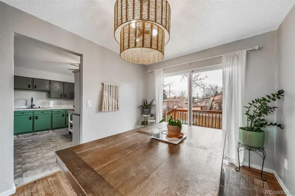 a view of a living room and a floor to ceiling window or kitchen