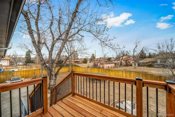 a view of a balcony with trees