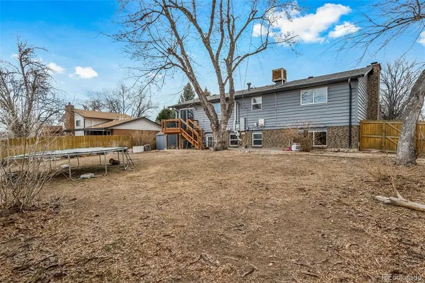 a view of house with a yard