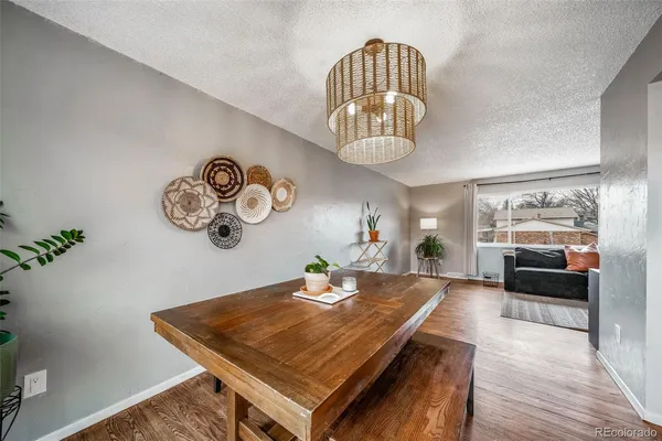 a view of a room with furniture and chandelier