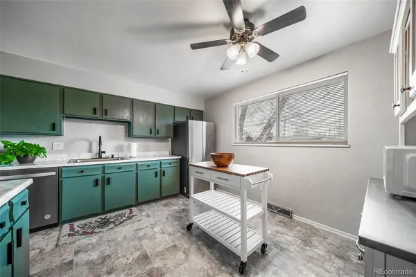 a kitchen that has a cabinets and a stove top oven